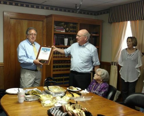 Kenneth Shinbaum awarded his plaque for 40 years of service with employees at McPhillips Shinbaum LLP